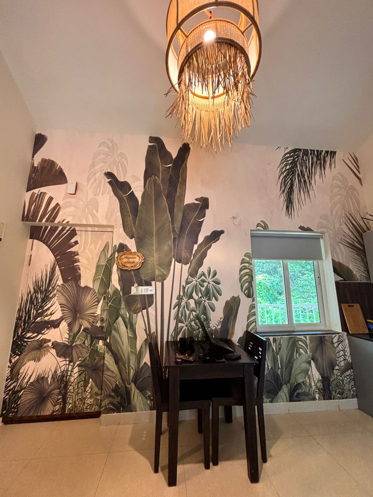 Anjuna Abode 1 — tropical botanical mural with fringe pendant lamp