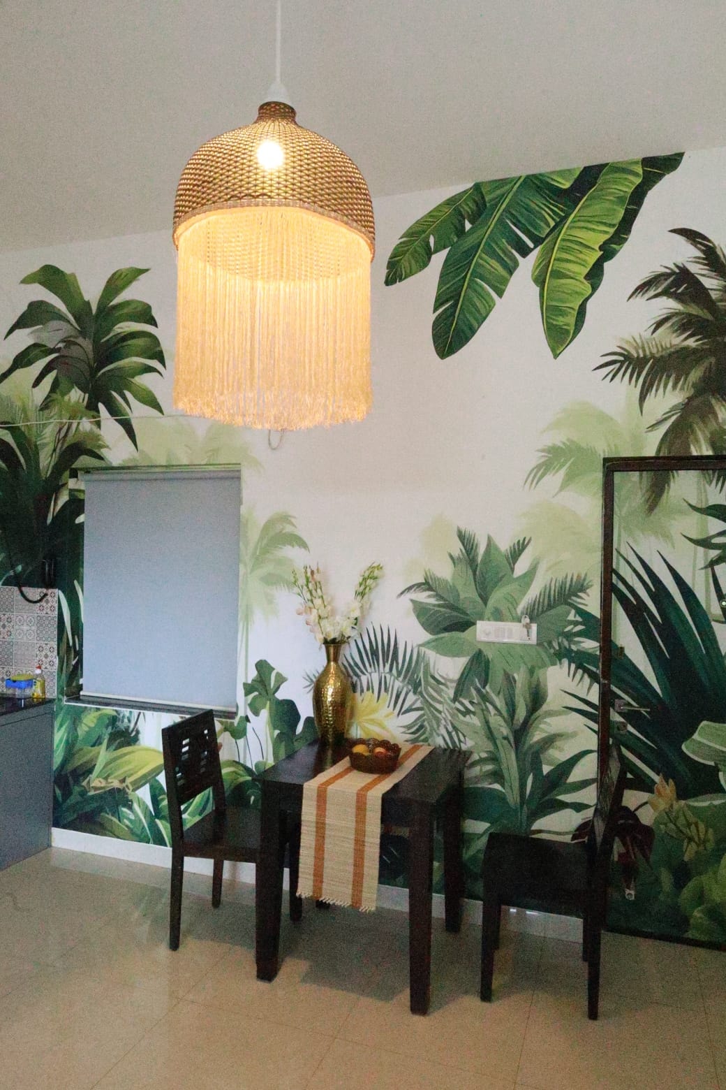 Anjuna Abode 2 — dining table with tropical botanical mural