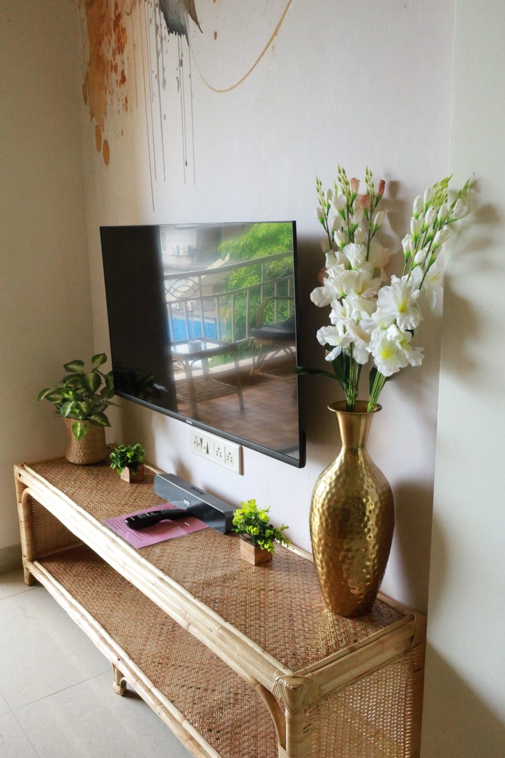 Anjuna Abode 2 — dining area with fringe pendant lamp and jungle mural
